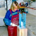Kathy, at Property Repair Systems, inserting steel bars into a Timber Resin Splice beam